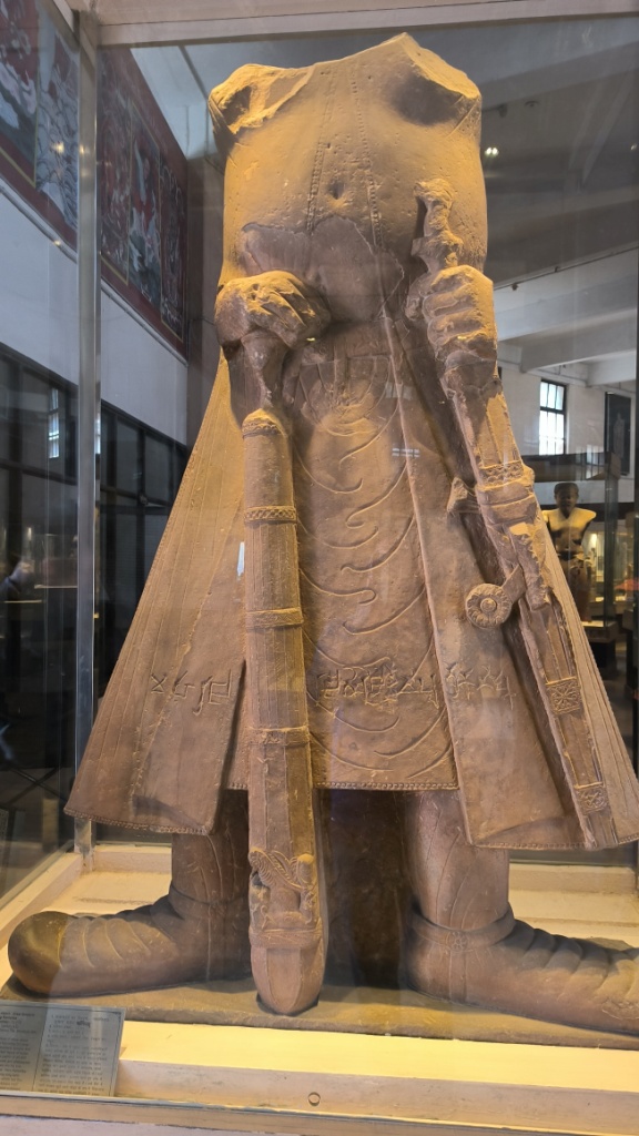 Headless statue of Kanishka